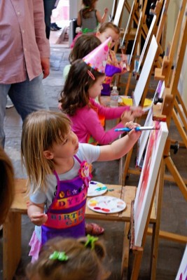 Dylan and guests paint at her birthday party
